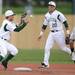 Eastern Michigan senior Tucker Rubino reaches for a ball tossed from junior Austin Williams as he beats Michigan sophomore Cole Martin to second base for the out at Eastern on Wednesday.  Melanie Maxwell I AnnArbor.com
